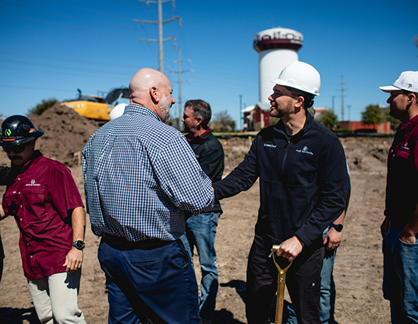 Several Wright Naeger Dentistry team members volunteering at a construction site