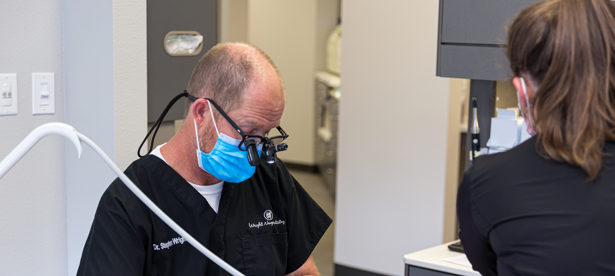 College Station emergency dentist and assistant treating a patient