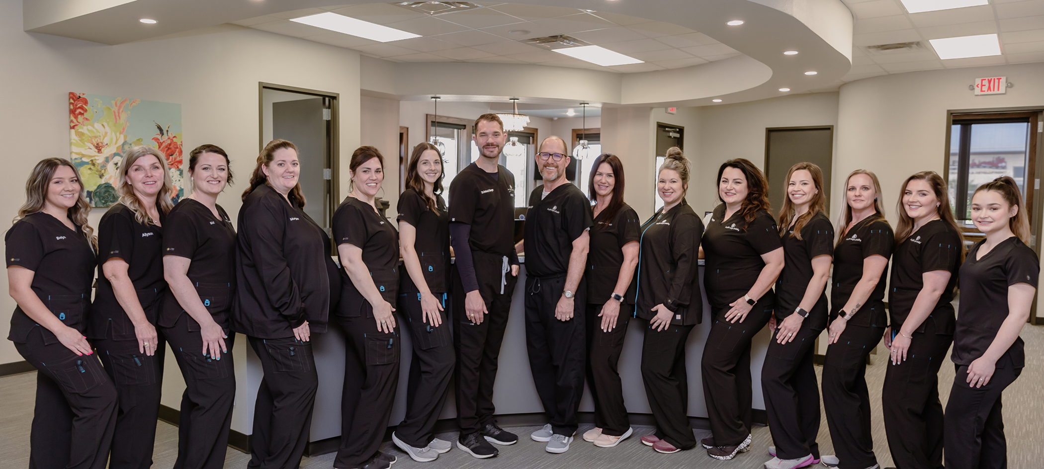 The smiling dental team at Wright Naeger Dentistry in College Station