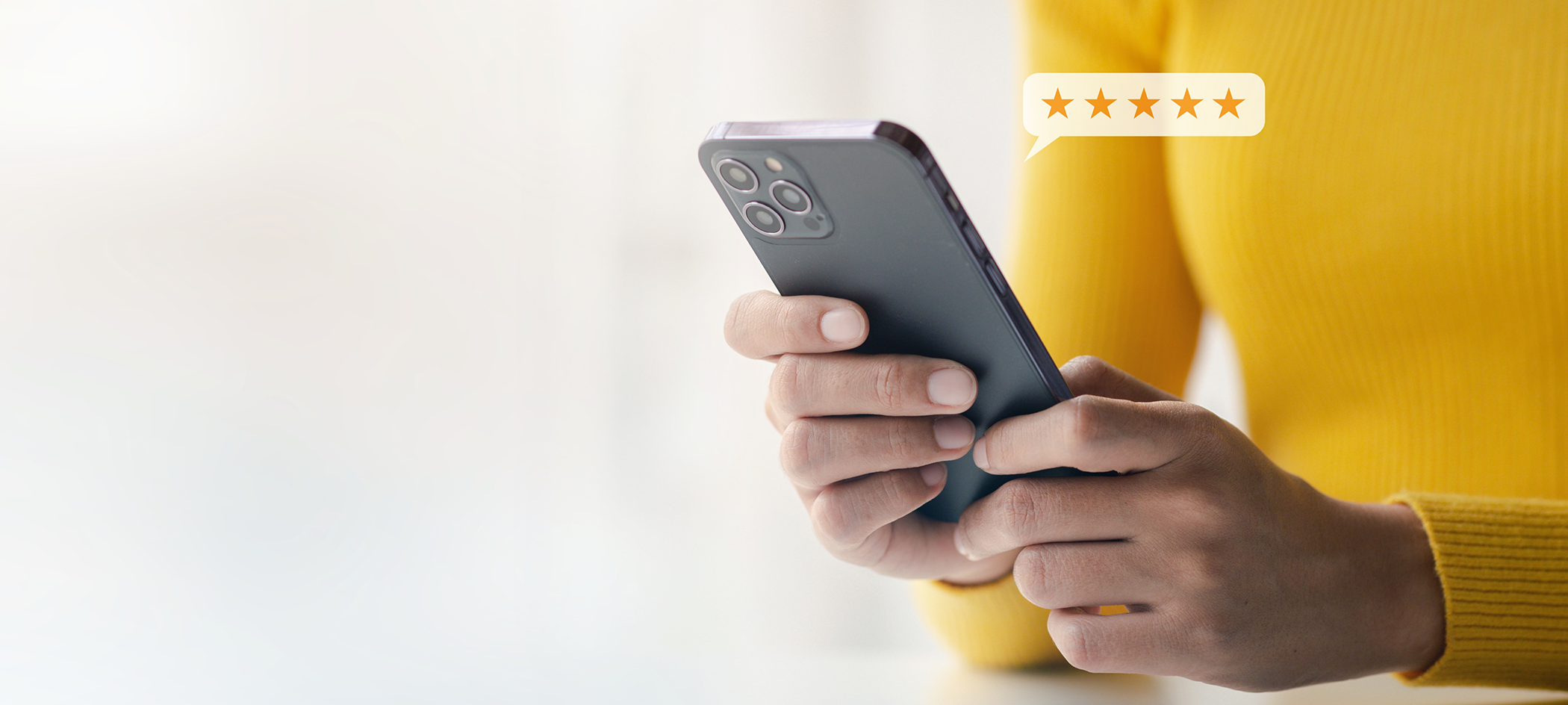 Person writing a five star review on their phone